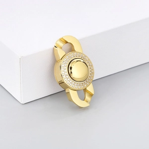 Detailed view of a gold-plated circular clasp with sparkling rhinestones for jewelry DIY
