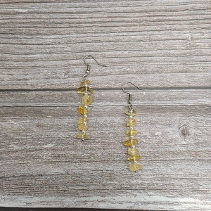 Detail shot of long tassel earrings with handmade natural citrine beads and silver spacers