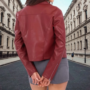 Slim fit dark red faux leather jacket for women styled with a grey mini skirt