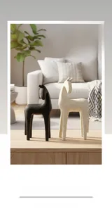 Close-up of black and white horse statues with a matte resin texture in a modern room