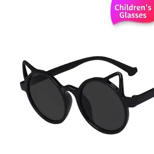 Cute cat-ear style children sunglasses with round gray lenses and lightweight black frame