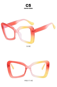 Detail view of large polygon eyeglass frames with red and yellow gradient finish