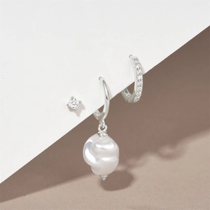 Detailed view of S925 silver earring set with turquoise, pearl and zircon accents