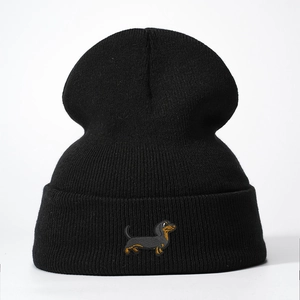 Classic black ribbed knit beanie featuring a detailed dachshund embroidery on the cuff