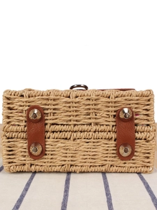 Handmade woven paper straw bag with leather reinforcements and protective metal feet