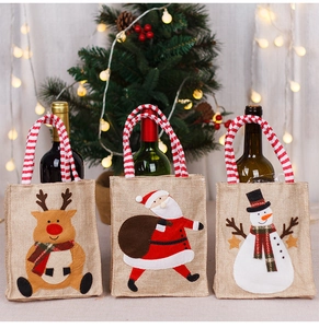 Detail of Christmas burlap wine bags featuring Santa, Reindeer and Snowman appliques