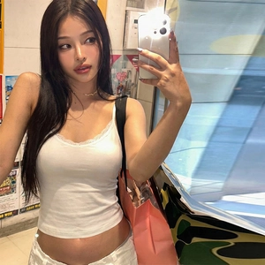 Detailed mirror selfie of white lace trim slim fit camisole with V-neckline design