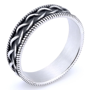 Macro shot of silver Viking woven texture on a stainless steel band for men