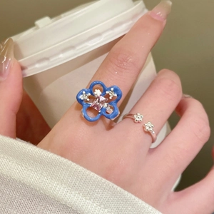 Elegant blue enamel flower ring set with pink zircon and white crystal details