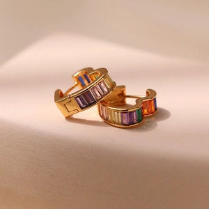 18K gold plated heart earrings with colorful gradient zircon stones on beige stone