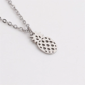 Polished stainless steel pineapple pendant necklace with hollow design on white background