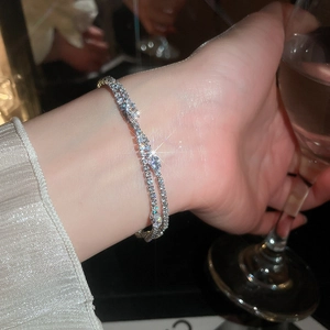 Detailed view of luxury 18k gold plated cubic zirconia double layer bracelet.