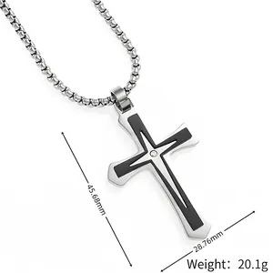 Double-layered silver cross pendant with black inlay and crystal on a box chain