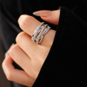 Macro shot of a silver multi-layer crisscross ring with pavé-set shimmering cubic zirconia