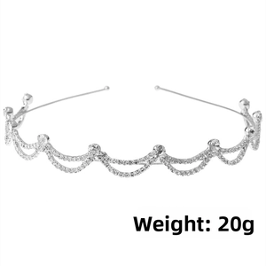 Detail shot of a lightweight 20g silver bridal headband with rhinestones and wave patterns