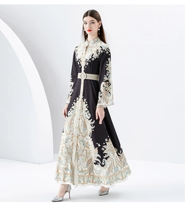 Detail of vintage paisley print dress with stand collar and elegant trumpet sleeves