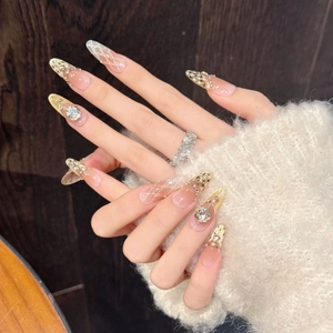 Luxe handmade almond press-on nails with cat-eye diamond patterns and rhinestones