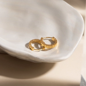 Polished 18K gold-plated ribbed hoop earrings with a textured geometric square design