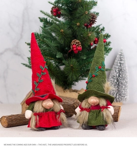 Detail of Christmas gnomes with spiral hats and berry accents on a rustic wood background