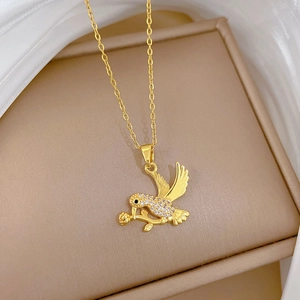 Elegant gold titanium steel necklace featuring a swallow with a rose and crystal details