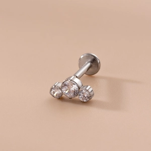 16G stainless steel labret stud featuring a cluster of three clear zircon stones