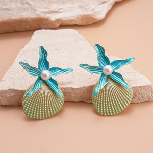 Detail of beach-style starfish and seashell earrings with pearls and green paint finish