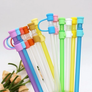 Detail showing various colors of dust-proof silicone straw caps on reusable straws