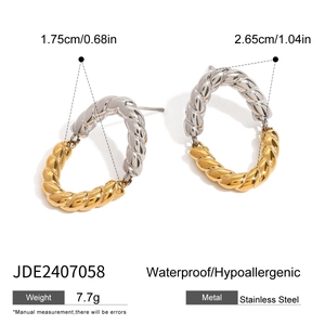 Polished stainless steel oval twisted hoop earrings with gold and silver two-tone finish