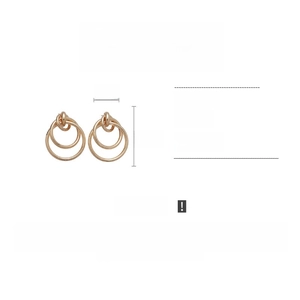 Detail view of geometric nested gold hoop earrings with specific 5cm width and 6.3cm height