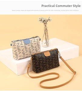 Detail view of mini crossbody bag with VIFN monogram print and leather shoulder strap