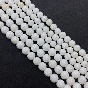 Macro shot of 8x12mm white butterfly shell beads for jewelry making necklaces