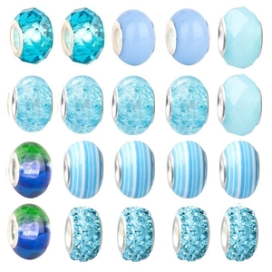 Macro view of assorted blue and green crystal glass beads for DIY jewelry making