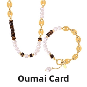 Detail of coffee bean link jewelry set with pearls and brown tiger eye stones