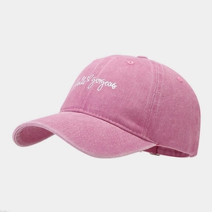 Detailed embroidery of white Hello Gorgeous text on pink cotton baseball cap