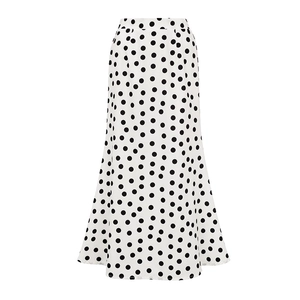 Detailed view of white polka dot mermaid skirt with elegant drape and A-line silhouette