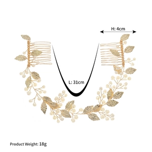Detail view of bridal hair vine with golden leaves and pearls, 31cm length and 18g weight