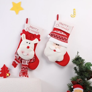 Detail of Christmas stockings with Santa and Reindeer 3D designs and Merry Christmas text