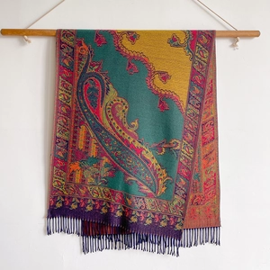 Detail of ethnic cashmere-feel scarf with colorful patchwork and tassel hem fringe
