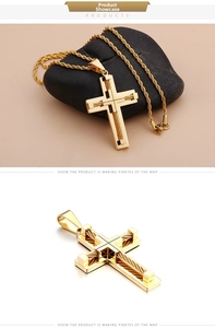 Detail of gold titanium steel cross pendant with wire texture and gold rope chain