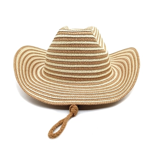 Detail view of woven straw cowboy hat with brown and beige stripes and windproof cord