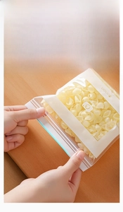 Detail of transparent food storage bag with easy-open tab design and pasta inside