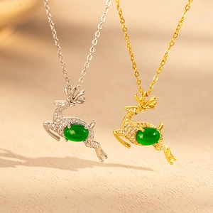 Elegant emerald reindeer necklaces in gold and silver finishes with crystal accents