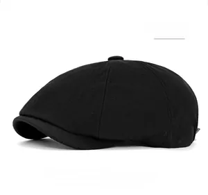Macro view of black herringbone pattern and texture on classic newsboy cap fabric