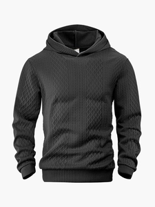 Detailansicht eines schwarzen Herren-Hoodies mit 3D-Jacquard-Rauten und gestreifter Textur