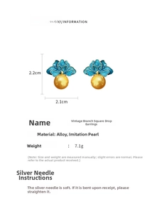 Macro view of vintage blue floral earrings with pearl drop and dimensions 2.2x2.1cm