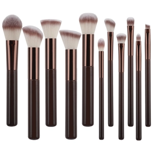 12-piece makeup brush set with solid wood handles and rose gold ferrules on white background