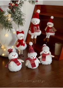 Set of six plush red and white Christmas dolls including snowmen and girls for tree decor