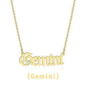 Detailed close-up of gold Gemini letter pendant in gothic font on a delicate steel chain