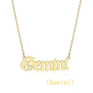 Detailed close-up of gold Gemini letter pendant in gothic font on a delicate steel chain