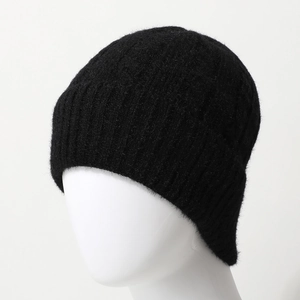 Classic black cable knit beanie for winter featuring ribbed texture and soft warm fleece